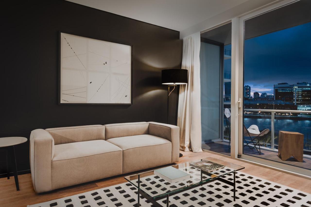 Hotel SLS Buenos Aires Puerto Madero Exterior foto A living room in a typical apartment